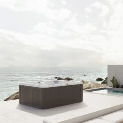 Jacuzzi® J245™ / J245IP™ - 7 Person Hot Tub 26 Jacuzzi® J245™ / J245IP™ - 7 Person Hot Tub -Outdoor Living Store JHT J245 Lifestyle Silverwood Cropped squae